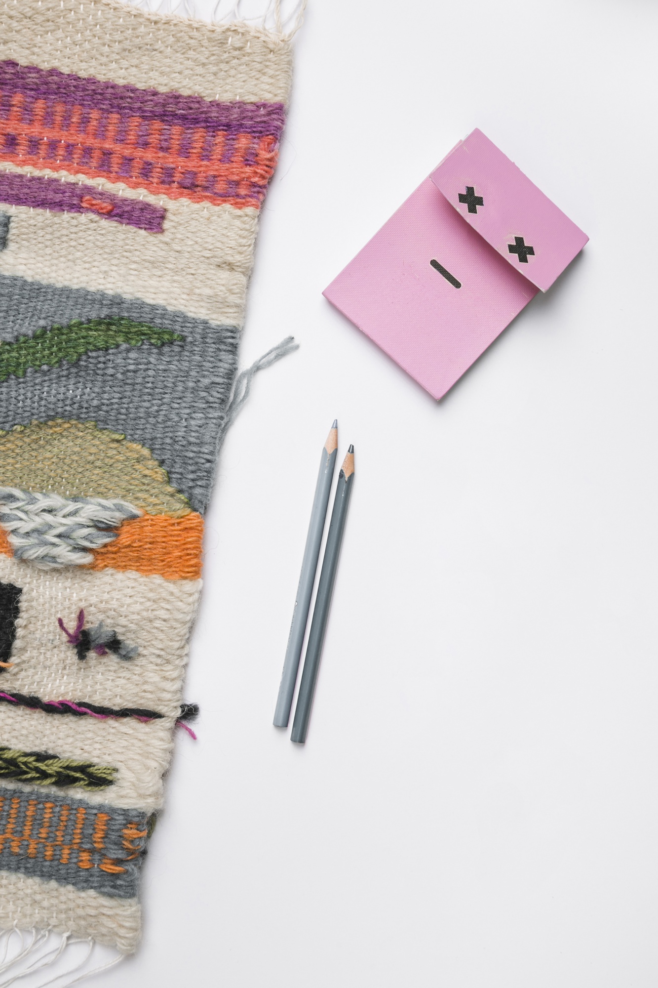 Large editorial photo of embroidered textile on table
